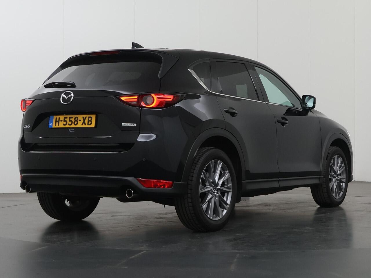 Mazda CX-5 2.0 SkyActiv-G 165 Luxury | 2000kg trekgewicht | Trekhaak | Navigatie | Stoelverwarming/koeling | Ele. verstelbare stoelen + geheugen | 360 Camera | DAB | Apple Carplay/Android Auto | HUD | Bose Audio |