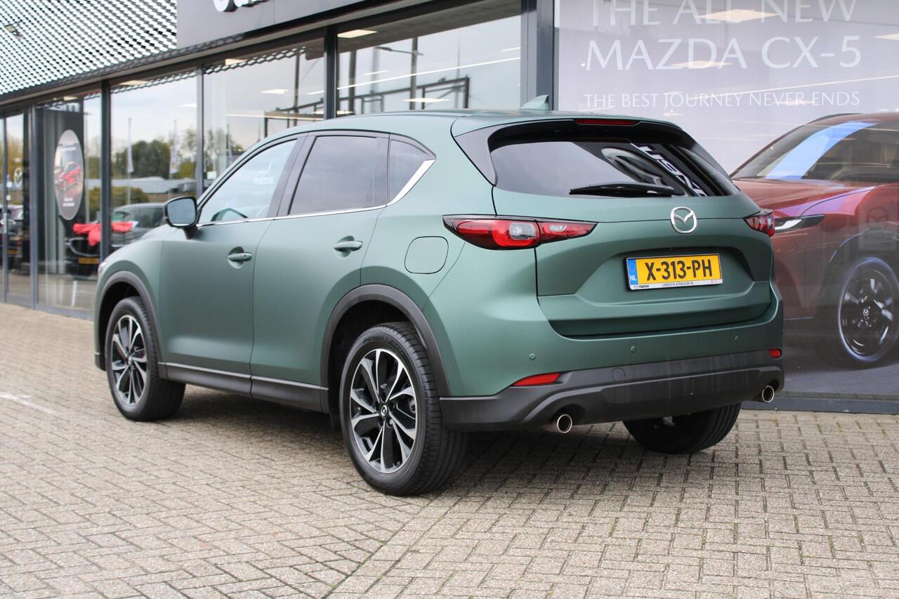 Mazda CX-5 2.0 e-SkyActiv-G M Hybrid 165 Exclusive-Line+Com.P , Automaat, Matte Metallic Pine Green gewrapped, Black Comfort Pack, Navi, Adap.Cruise, Clima, Apple Carplay, 360 Camera, PDC, HUD, Stuur/Stoelverwarming, 19" LMV