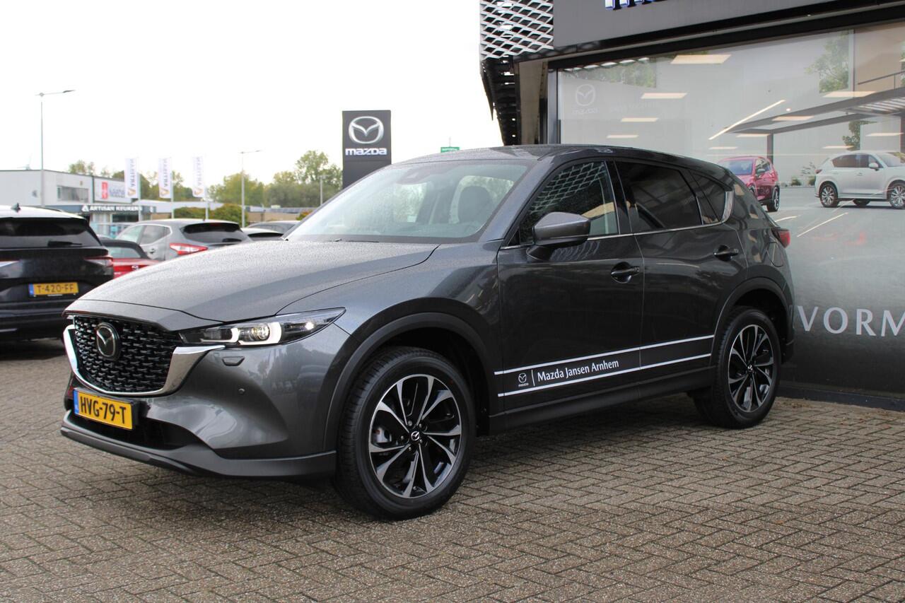 Mazda CX-5 2.0 e-SkyActiv-G M Hybrid 165 Exclusive-Line , Demovoordeel ¤ 9.100,-, Black Comfort Pack, Navi, Adap.Cruise, Clima, Leder, Apple Carplay, 360 Camera, PDC, HUD, Stoelverwarming/ventilatie, 19" LMV