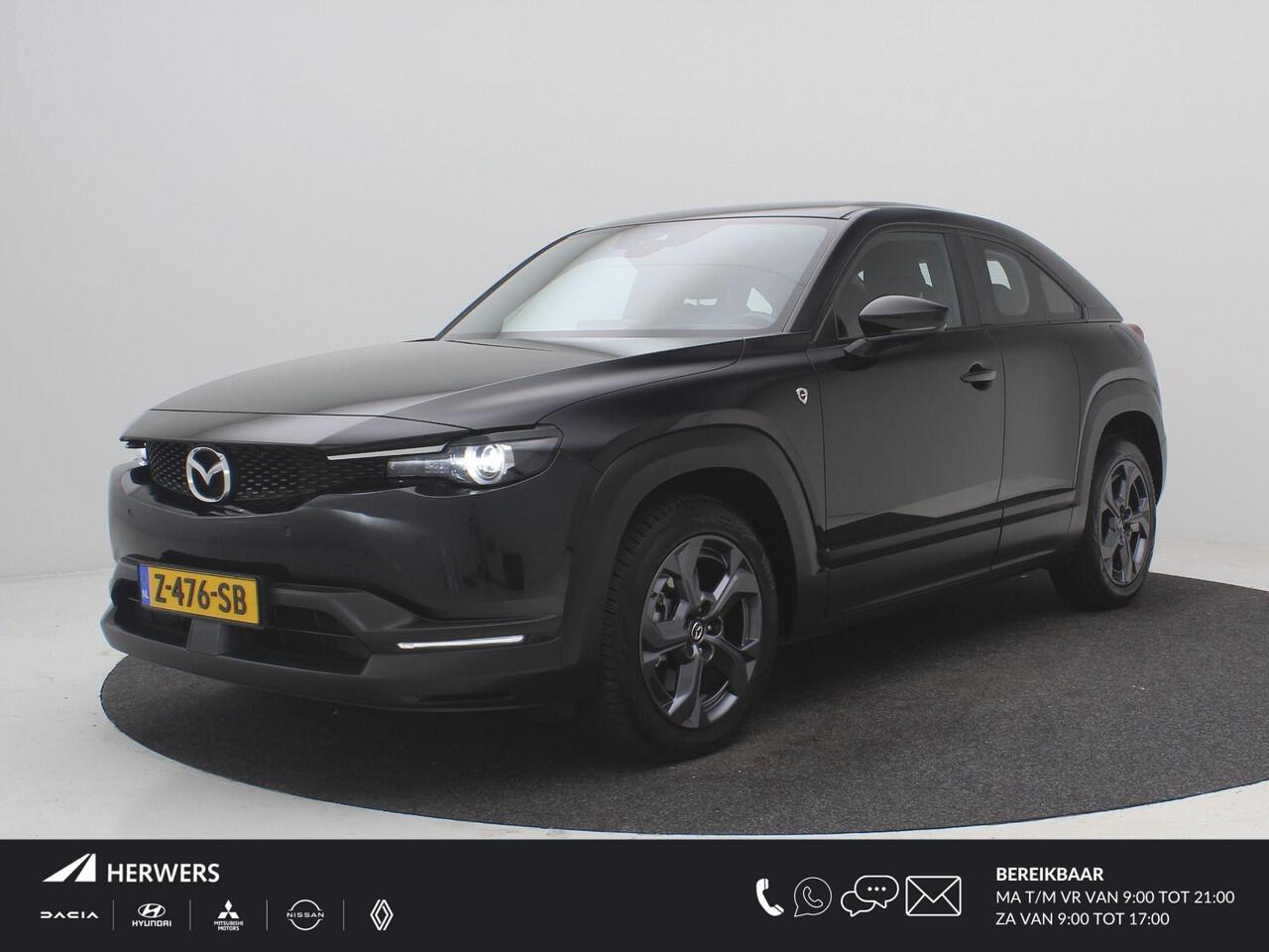 Mazda MX-30 e-SkyActiv R-EV 170 Exclusive-line AUTOMAAT / Plug-in-Hybride / 1ste Eigenaar / Historie aanwezig / HUD Display / Adaptieve Cruise Control / All seasonbanden / Navigatie / Stoel & Stuurwiel verwarming / Full Option /