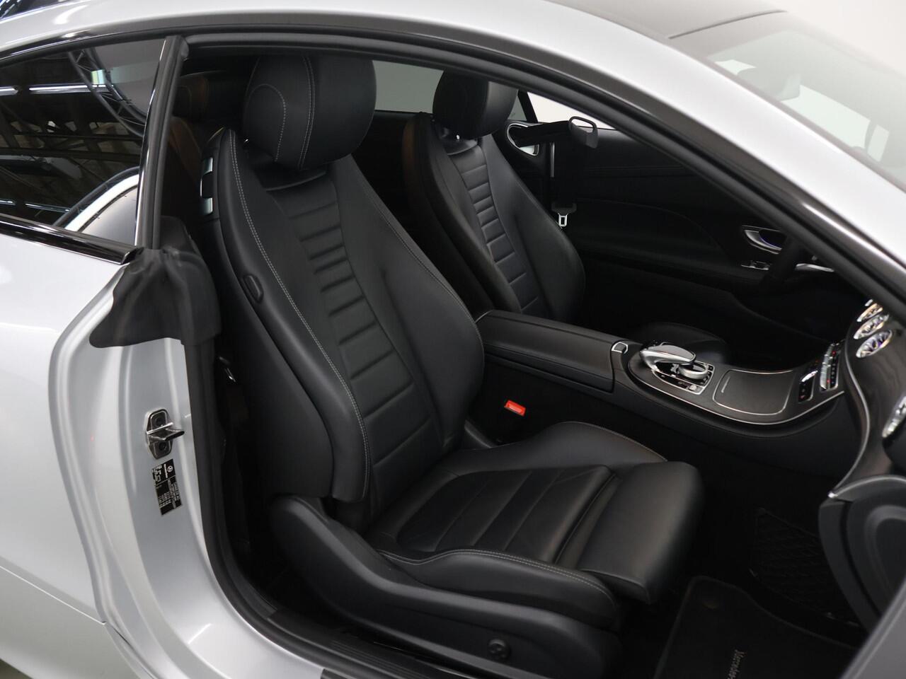 Mercedes-Benz E-KLASSE Coupé 200 Premium Plus | AMG | Night | Panoramadak | Memory | Burmester | Rijassistentiepakket | Lederen bekleding | 20" lichtmetalen velgen |