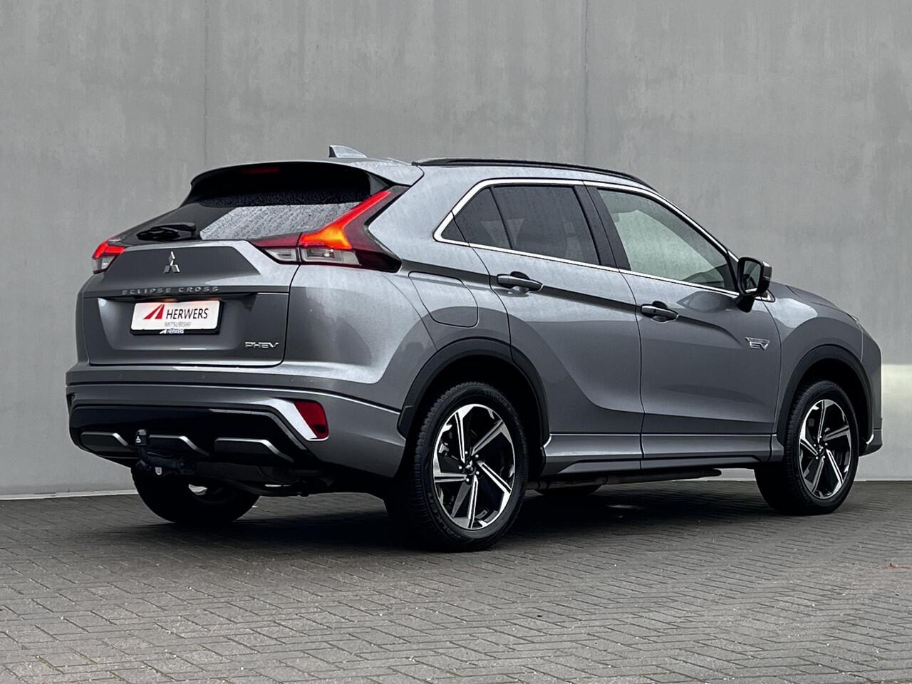 Mitsubishi ECLIPSE Cross 2.4 PLUG-IN HYBRID 4WD S-AWC Executive Automaat / Fabrieksgarantie tot 12-2030 / Trekhaak 1.500 kg / Leder / Elektrische stoelen / Navigatie / Stuur-, stoel - & achterbankverwarming / HUD / Camera 360° / 18" LM wielen + All Season banden /