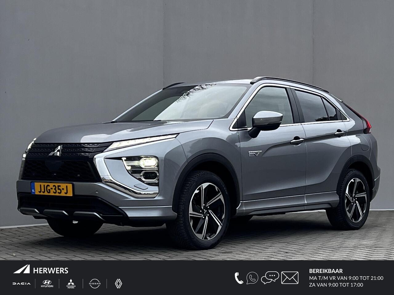 Mitsubishi ECLIPSE Cross 2.4 PHEV Business Executive 4WD Automaat / Fabrieksgarantie tot 11-2031 mogelijk ** / Goed onderhouden / Camera 360° / Stuur-, stoel- en achterbankverwarming / Adaptieve Cruise Control / Apple Carplay Android / 18" LM wielen met All Season banden /