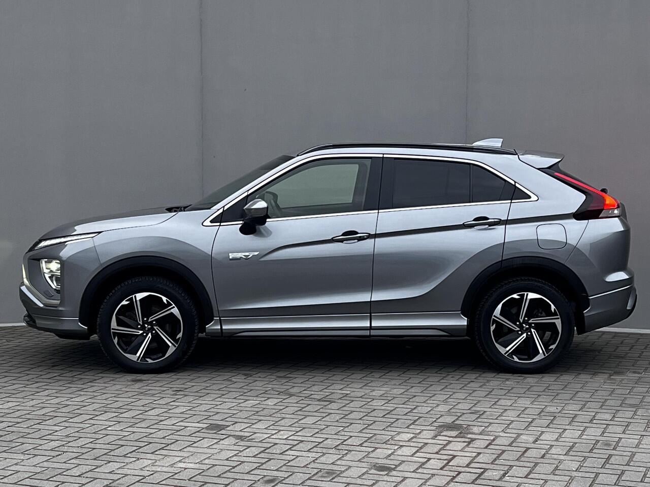 Mitsubishi ECLIPSE Cross 2.4 PHEV Business Executive 4WD Automaat / Fabrieksgarantie tot 11-2031 mogelijk ** / Goed onderhouden / Camera 360° / Stuur-, stoel- en achterbankverwarming / Adaptieve Cruise Control / Apple Carplay Android / 18" LM wielen met All Season banden /