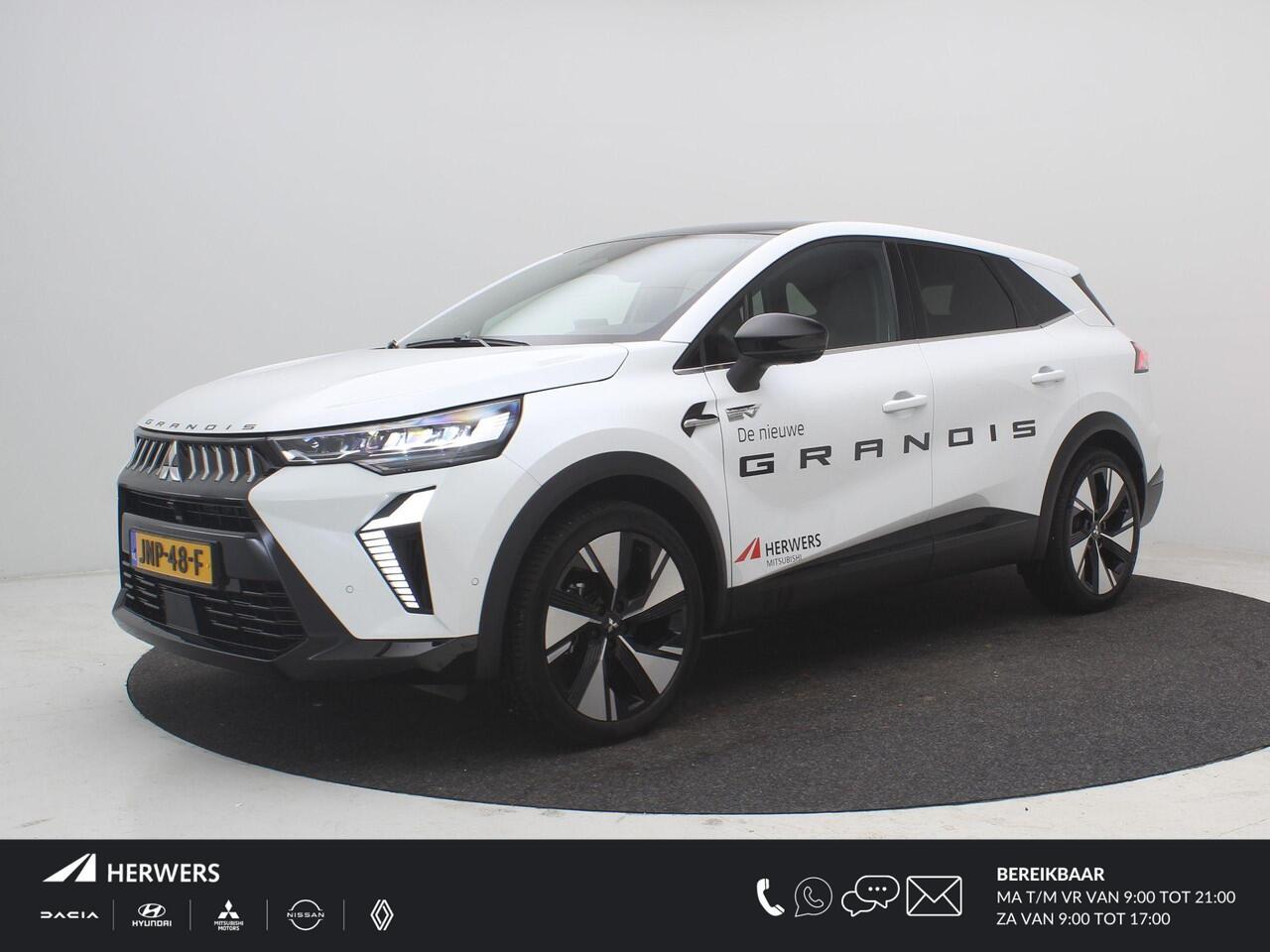 Mitsubishi GRANDIS 1.8 HEV Instyle AUTOMAAT / 8 jaar fabrieksgarantie / Elektrochromatisch glazen panoramadak / Google Assistent / Stuurwiel- en Stoelverwarming voor / Adaptieve Cruise Control / Verwarmde Voorruit / Climate Control / Keyless Entry & Start / Elektrisch Verst