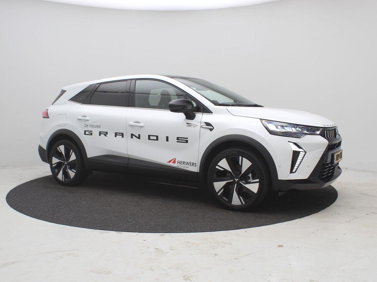 Mitsubishi GRANDIS 1.8 HEV Instyle AUTOMAAT / 8 jaar fabrieksgarantie / Elektrochromatisch glazen panoramadak / Google Assistent / Stuurwiel- en Stoelverwarming voor / Adaptieve Cruise Control / Verwarmde Voorruit / Climate Control / Keyless Entry & Start / Elektrisch Verst