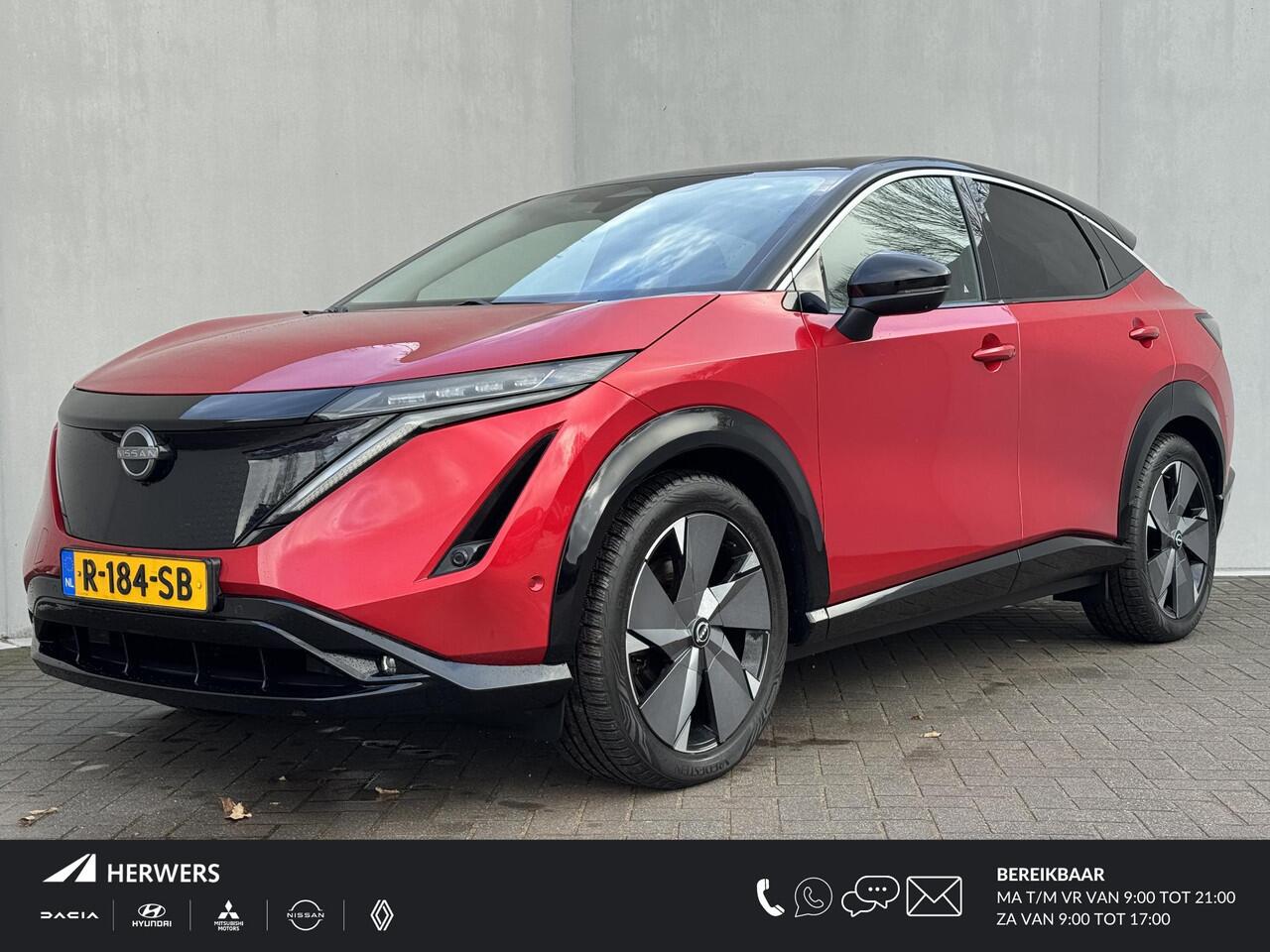 Nissan Ariya Evolve 91 kWh / Warmtepomp / Stuur- & Stoelverwarming / Voorruitverwarming / Geventileerde Voorstoelen / Binnenspiegel Camera / Schuif & Kanteldak / Head-Up Display / Bose Premium Audio / Adaptieve Cruise Control / Apple Carplay & Android Auto /