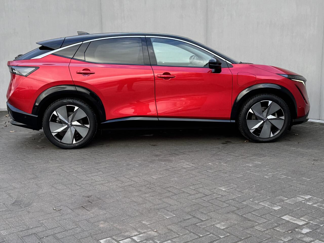 Nissan Ariya Evolve 91 kWh / Warmtepomp / Stuur- & Stoelverwarming / Voorruitverwarming / Geventileerde Voorstoelen / Binnenspiegel Camera / Schuif & Kanteldak / Head-Up Display / Bose Premium Audio / Adaptieve Cruise Control / Apple Carplay & Android Auto /