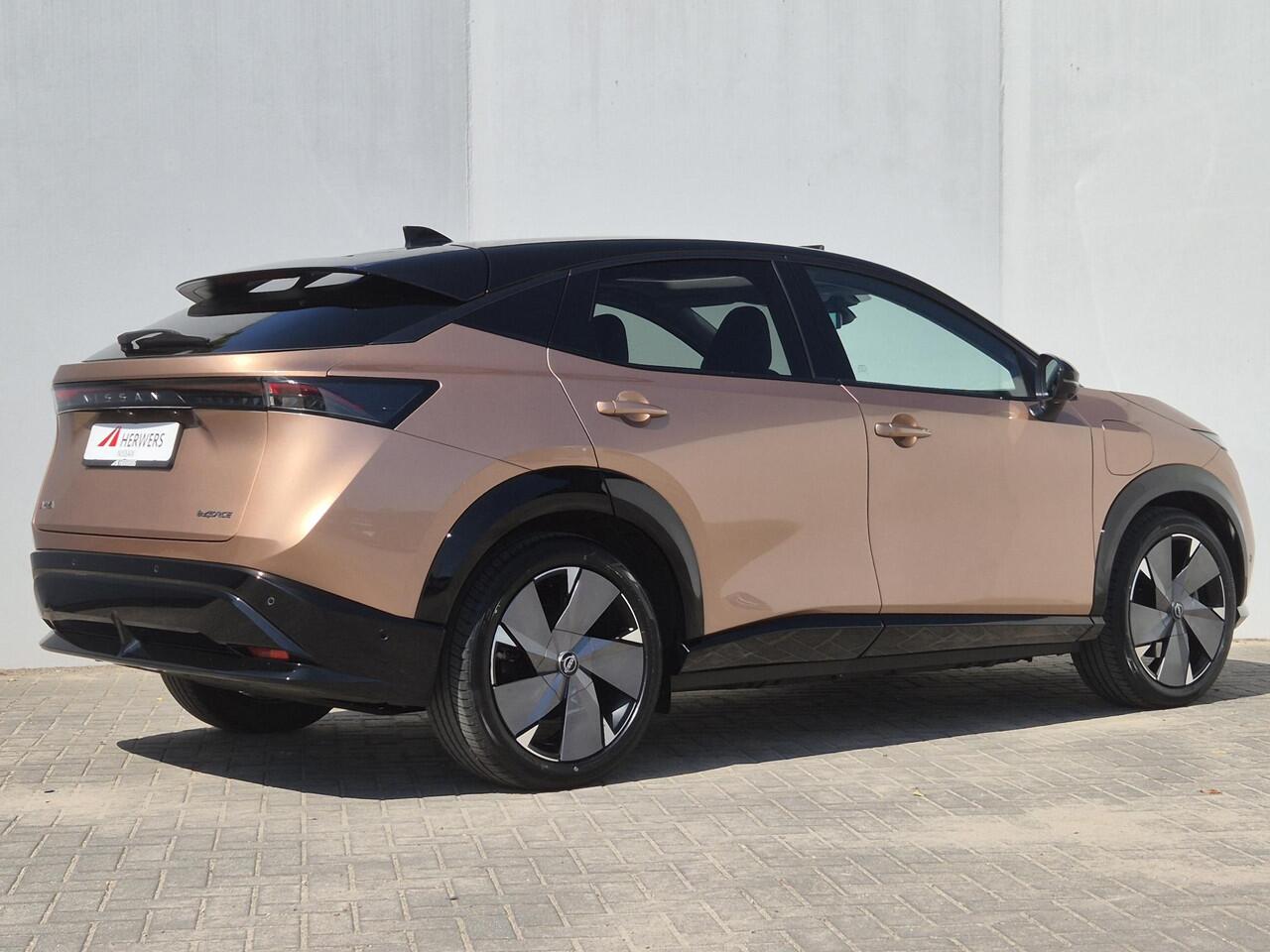 Nissan Ariya e-4ORCE Evolve+ Pack 91 kWh Automaat / AWD / 4WD/ Vision Tech / HUD / Trekgewicht 1500 kg / Glazen schuif- en kanteldak / Bose Audio Systeem / Stuur-, Stoel en Achterbankverwarming / Rondomzicht camera / Elektrische achterklep /