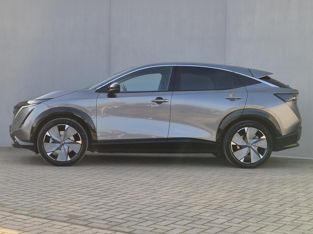 Nissan Ariya Advance 66 kWh Automaat / Accu SOH 99% / Fabrieksgarantie tot 02-2027 / CCS snelladen / Elektrische achterklep / Stuur-& Stoel verwarming / Adaptief cruise control / 360 camera / warmtepomp / Apple Carplay Android Auto /