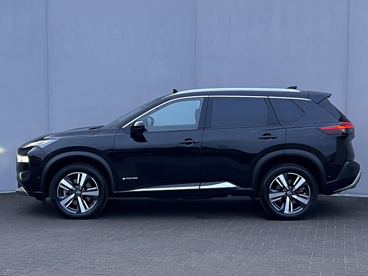 Nissan X-TRAIL 1.5 e-Power Tekna Automaat / Fabrieksgarantie tot 03-2028 < 100.000km / Leder / Panorama schuifdak / Elektrische stoelen en klep / Stuur-, stoel- & achterbankverwarming / Navi / HUD / Camera 360° / LM 19" wielen + All Season banden /