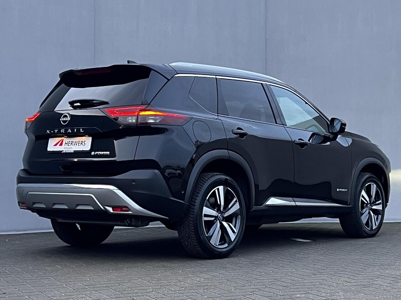 Nissan X-TRAIL 1.5 e-Power Tekna Automaat / Fabrieksgarantie tot 03-2028 < 100.000km / Leder / Panorama schuifdak / Elektrische stoelen en klep / Stuur-, stoel- & achterbankverwarming / Navi / HUD / Camera 360° / LM 19" wielen + All Season banden /