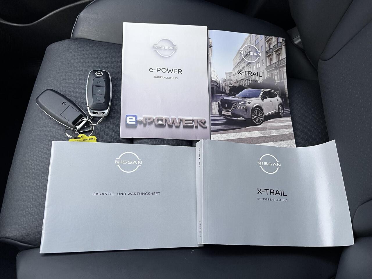 Nissan X-TRAIL 1.5 e-Power Tekna Automaat / Fabrieksgarantie tot 03-2028 < 100.000km / Leder / Panorama schuifdak / Elektrische stoelen en klep / Stuur-, stoel- & achterbankverwarming / Navi / HUD / Camera 360° / LM 19" wielen + All Season banden /