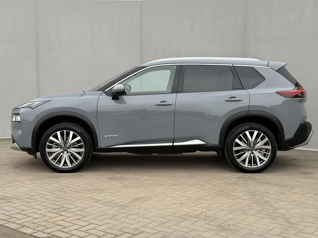 Nissan X-TRAIL 1.5 e-Power Tekna / Fabrieksgarantie tot 3-2028 / Dealer Onderhouden / HUD / 360 Camera / Lederen Bekleding / Adaptieve Cruise / Elektr. Stoelen + Memory / Elektr. Achterklep / Dodehoek Detectie / DAB / LED /