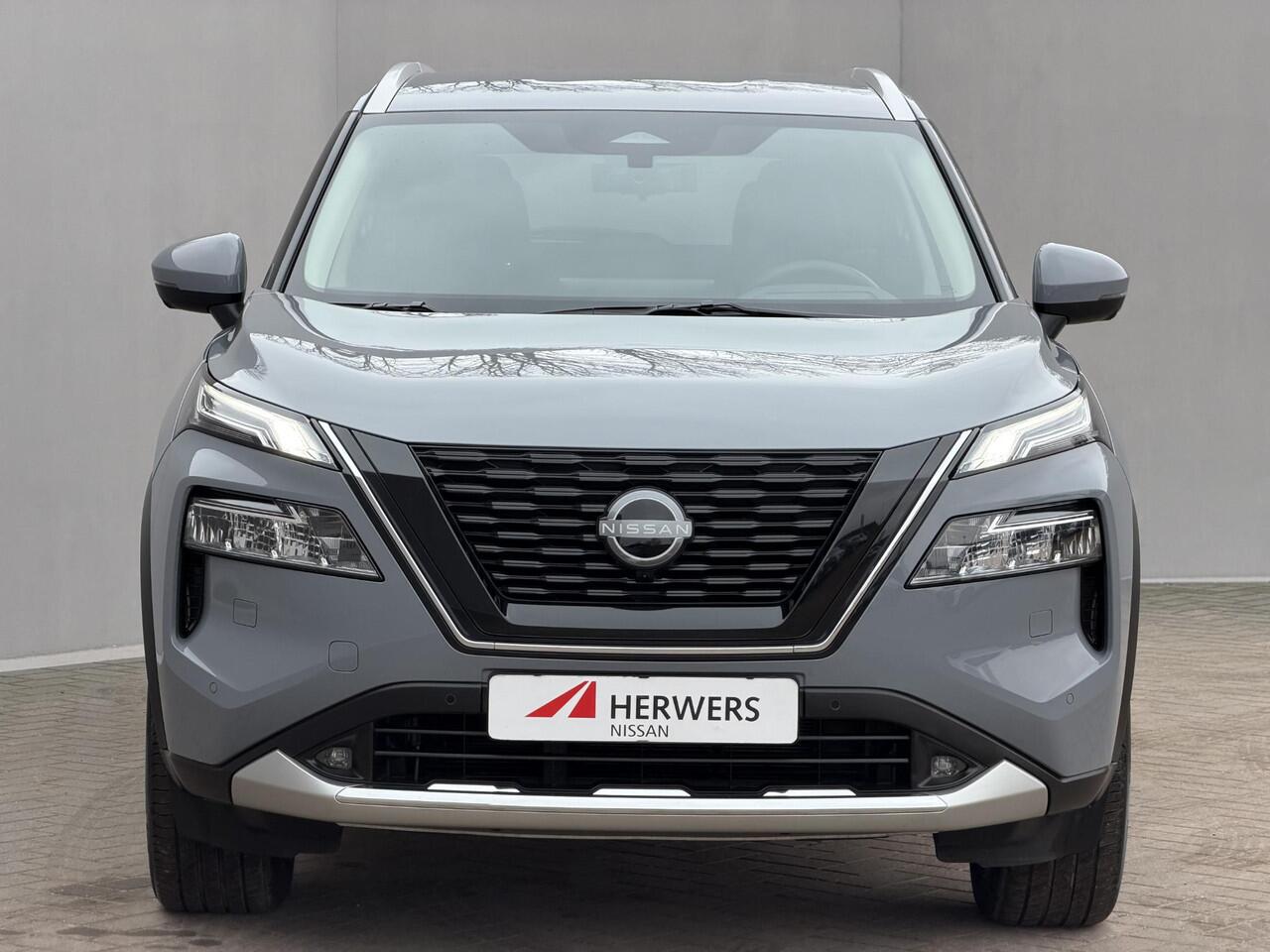 Nissan X-TRAIL 1.5 e-Power Tekna / Fabrieksgarantie tot 3-2028 / Dealer Onderhouden / HUD / 360 Camera / Lederen Bekleding / Adaptieve Cruise / Elektr. Stoelen + Memory / Elektr. Achterklep / Dodehoek Detectie / DAB / LED /