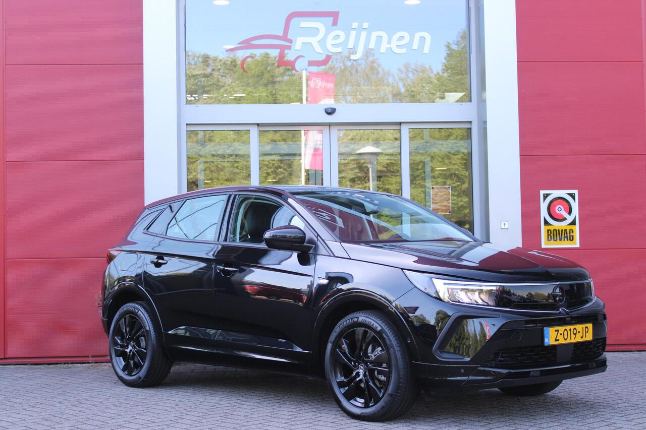 Opel Grandland 1.2 Turbo 136PK AUTOMAAT Hybrid GS | BLACK PACK | STOEL/STUUR VERWARMING | NAVIGATIE | APPLE CARPLAY/ANDROID AUTO | DODEHOEK DETECTIE | 18" LICHTMETALEN VELGEN | DAB+ RADIO | PARKEERSENSOREN VOOR + ACHTER | ADAPTIVE CRUISE CONTROL | ACHTERUITRIJ CAMERA |