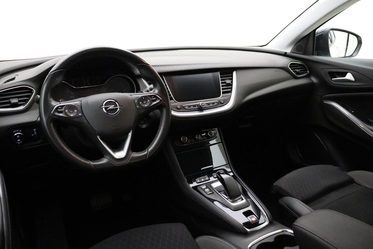 Opel Grandland X 1.6 Turbo 300pk Hybrid4 Elegance | Navigatie | Keyless | Camera | Parelmoer kleur | Electrische achterklep | Lichtmetalen velgen | AGR Comfortstoelen | Voorruitverwarming | Zwart dak