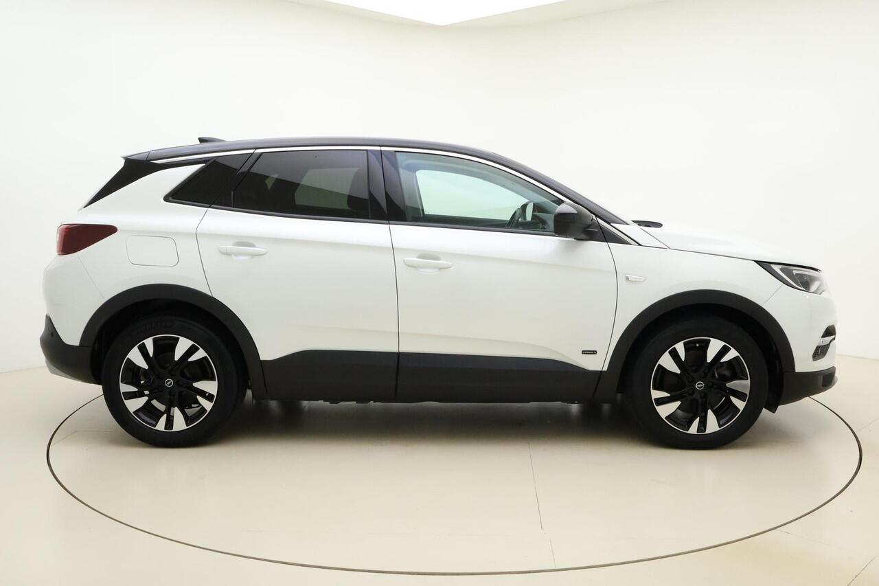 Opel Grandland X 1.6 Turbo 300pk Hybrid4 Elegance | Navigatie | Keyless | Camera | Parelmoer kleur | Electrische achterklep | Lichtmetalen velgen | AGR Comfortstoelen | Voorruitverwarming | Zwart dak