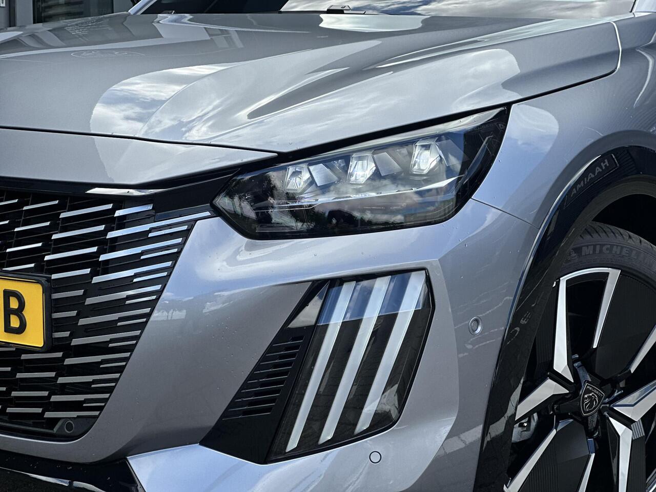 Peugeot 208 Hybrid 145 e-DCS6 GT | Parkeercamera/-sensoren (voor/achter) | Keyless Entry/Start | Dodehoek | Sfeerverlichting | Climate Control | Draadloze telefoonlader | Apple Carplay/Android Auto | Adaptive Cruise Control |