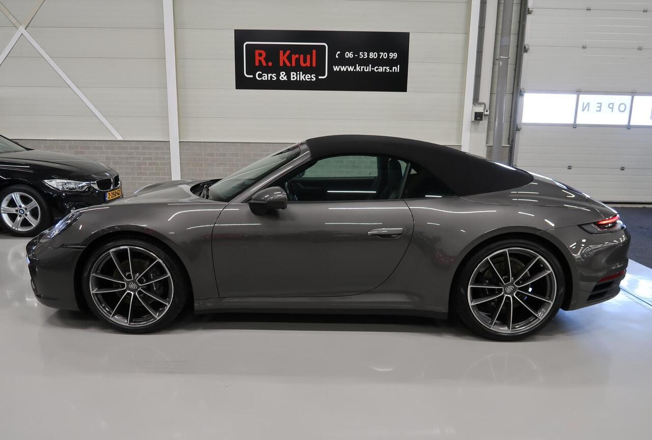 Porsche 911 Cabrio 3.0 Carrera 992 Bose 360 Camera Sportuitlaat PASM Sport-Chrono 21 inch Approved garantie 10/2026 Cabriolet 4 Nieuwe banden Groot onderhoud gehad PPF folie NIEUWSTAAT Flippers Stoelverkoeling LED PDLS