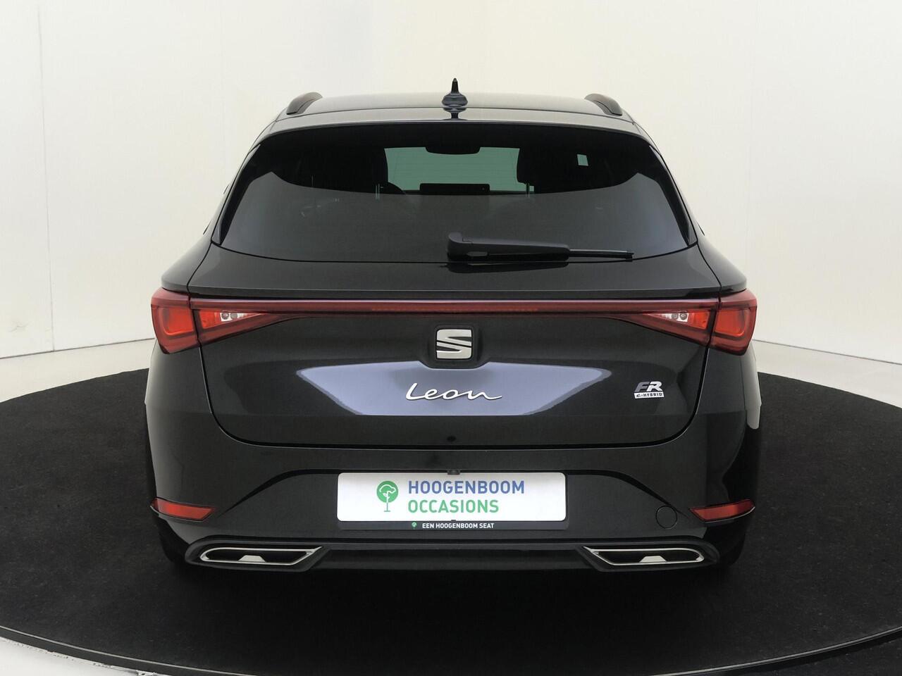 Seat LEON Sportstourer 1.5 TSI e-Hybrid FR Business | SoH 100% | Trekhaak | Parkeerassistent | Keyless | Adaptieve cruise control | Dodehoek detectie | Stoel- en stuurwielverwarming | Navigatie | Achteruitrijcamera |