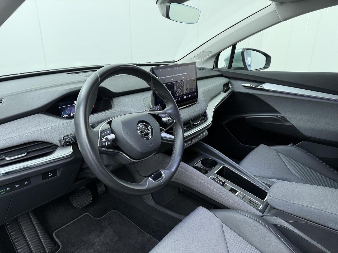 Skoda Enyaq iV 60 | 180 PK | SoH 89% | Trekhaak | Matrix LED koplampen | Voorstoelen verwarmd | 20" LM velgen | Achteruitrijcamera |