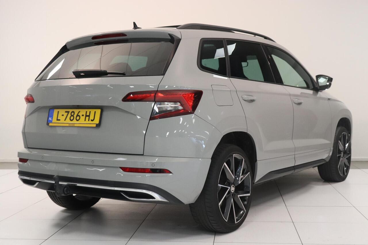 Skoda Karoq 1.5 TSI ACT Sportline Business | Adaptieve cruisecontrol | Camera | Panoramadak | Trekhaak | CANTON audio | Elektr achterklep | Stuur en stoel verwarming |