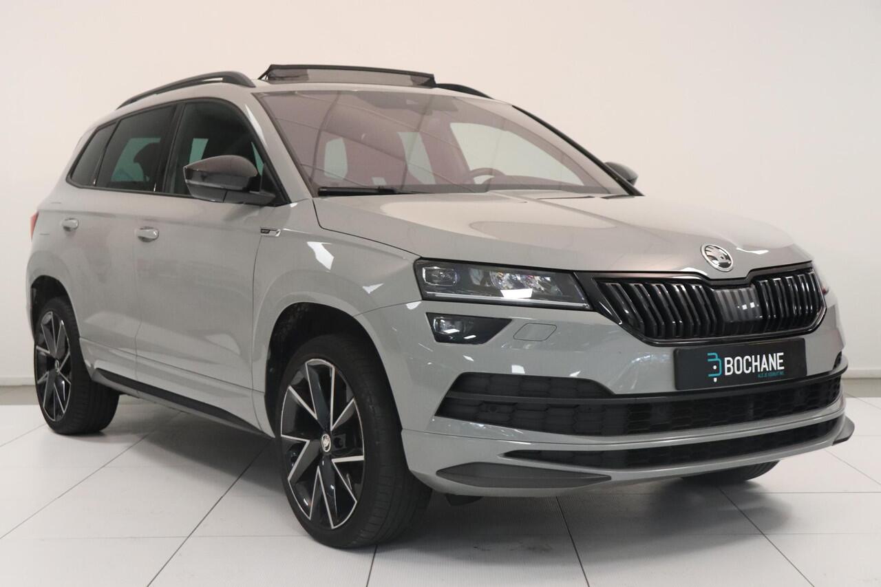 Skoda Karoq 1.5 TSI ACT Sportline Business | Adaptieve cruisecontrol | Camera | Panoramadak | Trekhaak | CANTON audio | Elektr achterklep | Stuur en stoel verwarming |