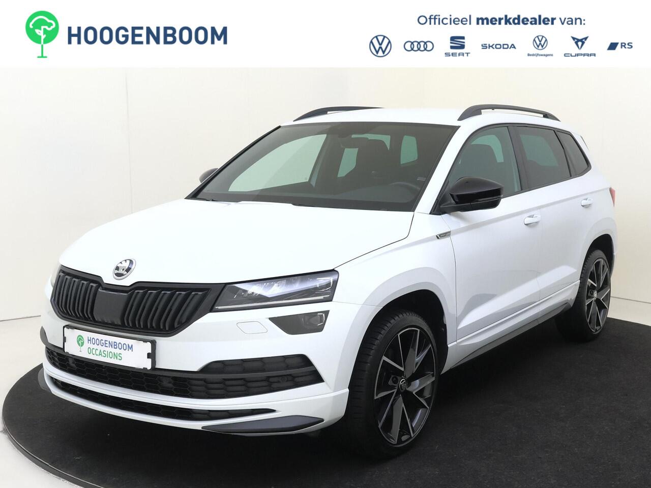 Skoda Karoq 1.5 TSI ACT Sportline Business | CANTON audio | Achteruitrijcamera | Cruise control | CarPlay | Keyless | Navigatie | Stoel- en stuurwielverwarming |