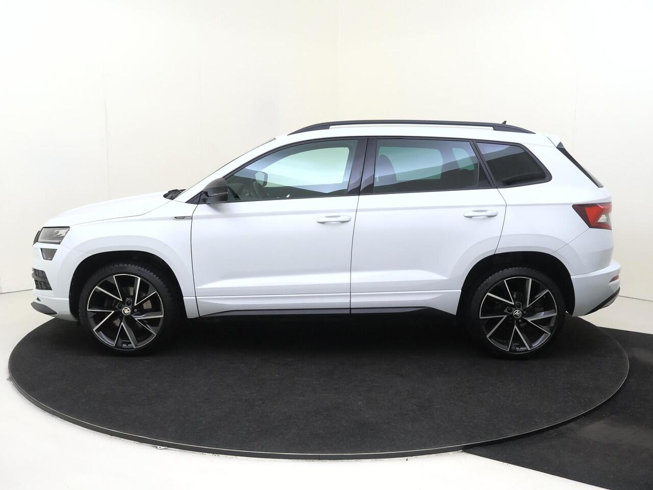 Skoda Karoq 1.5 TSI ACT Sportline Business | CANTON audio | Achteruitrijcamera | Cruise control | CarPlay | Keyless | Navigatie | Stoel- en stuurwielverwarming |