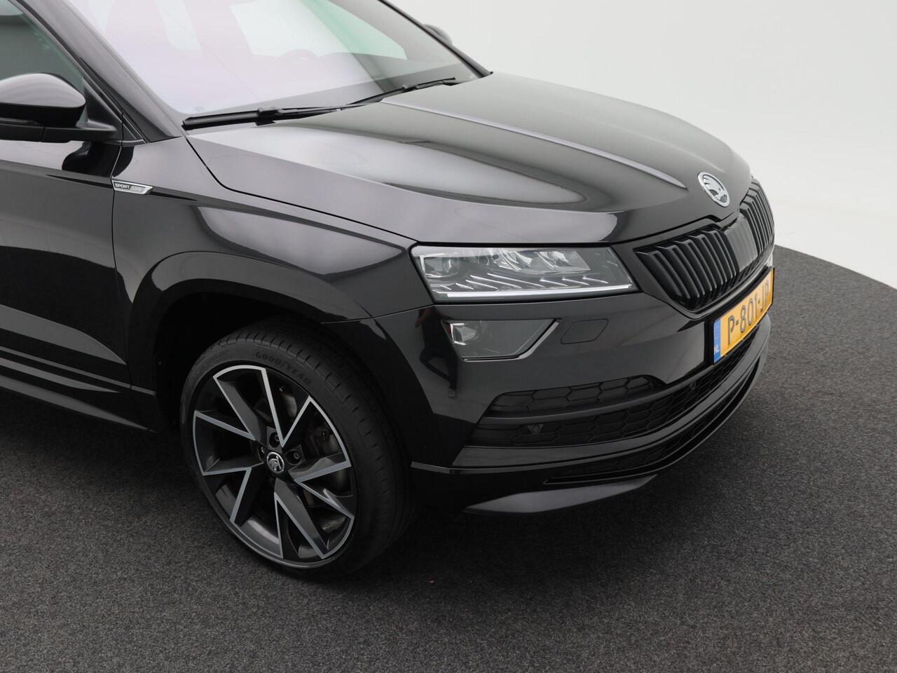 Skoda Karoq 1.5 TSi 150 Pk Automaat Sportline Business | Adaptive Cruise | Climate Control | Keyless | Stoelverwarming | Canton | Trekhaak | Navigatie | Camera | Carplay | LED | 123.026 Km!!
