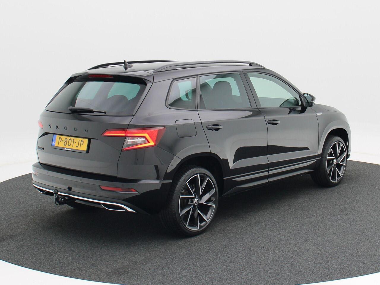 Skoda Karoq 1.5 TSi 150 Pk Automaat Sportline Business | Adaptive Cruise | Climate Control | Keyless | Stoelverwarming | Canton | Trekhaak | Navigatie | Camera | Carplay | LED | 123.026 Km!!