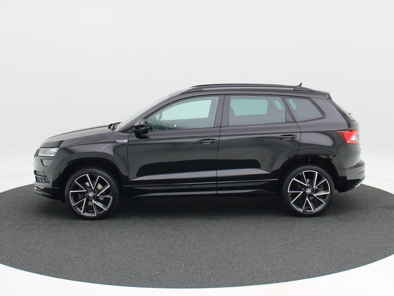 Skoda Karoq 1.5 TSi 150 Pk Automaat Sportline Business | Adaptive Cruise | Climate Control | Keyless | Stoelverwarming | Canton | Trekhaak | Navigatie | Camera | Carplay | LED | 123.026 Km!!