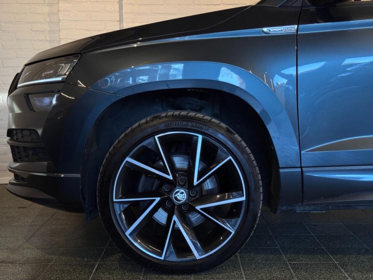 Skoda Karoq 1.5 TSI ACT Sportline Business DSG Virtual Trekhaak Navi Stoelverw 19''
