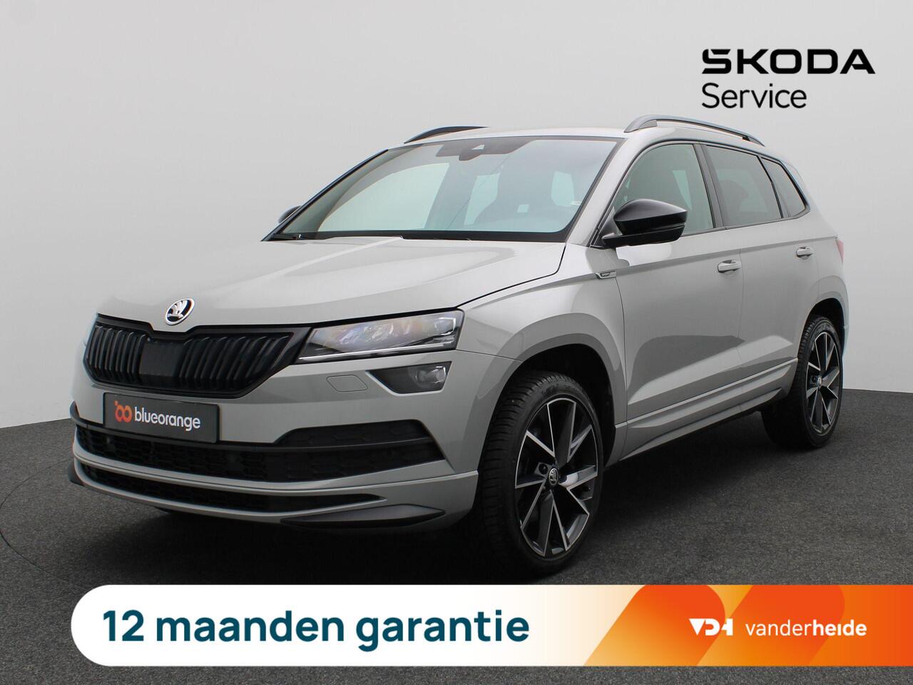 Skoda Karoq 1.5 TSI ACT Sportline Business 150PK DSG Trekhaak, Canton Audio, 19" LM Velgen, Elektr. Achterklep, Keyless, Adaptieve Cruise Controle, Achteruitrijcamera, Side Assist, Stoelverwarming, Voorruitverwarming