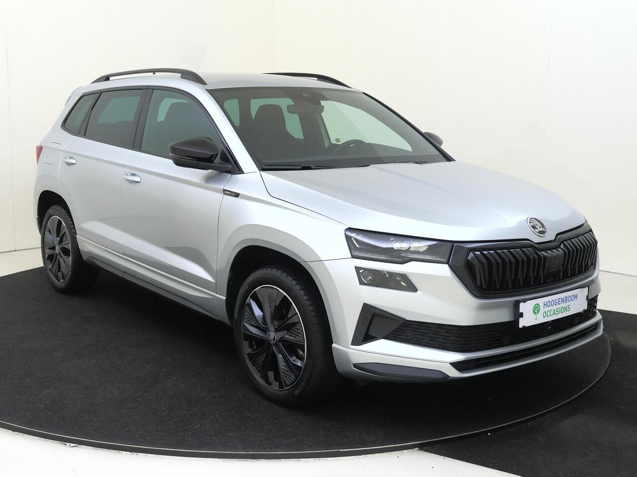 Skoda Karoq 1.5 TSI ACT Sportline Business | Trekhaak | Achteruitrijcamera | Keyless | Adaptieve cruise control | CarPlay | Digital cockpit | Navigatie |