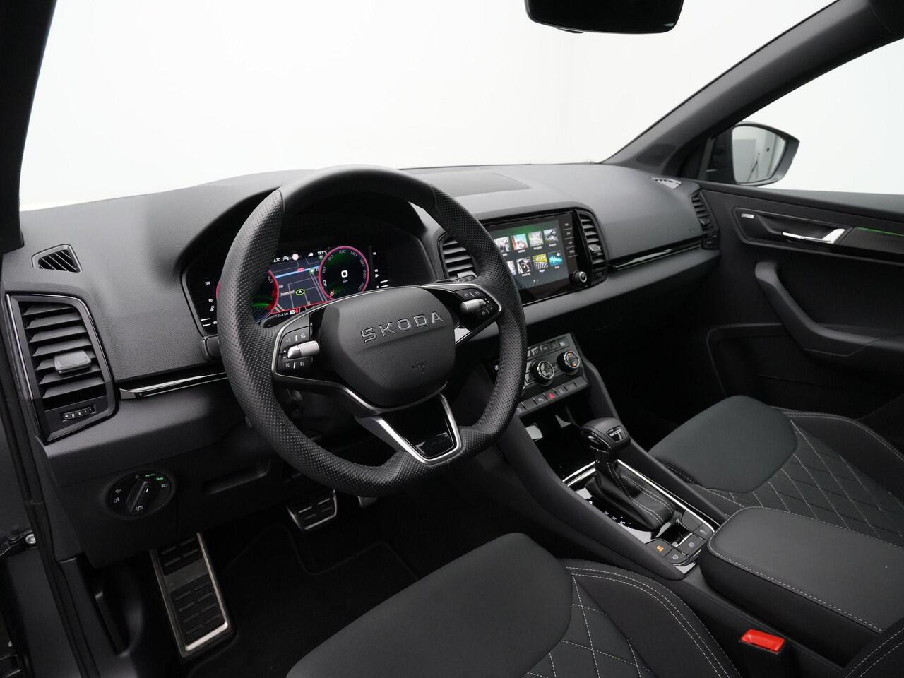 Skoda Karoq 1.5 TSI ACT 150 pk DSG Sportline Business | Canton | Stuur-/stoelverwarming | Achteruitrijcamera | Navigatie | Adaptive Cruise