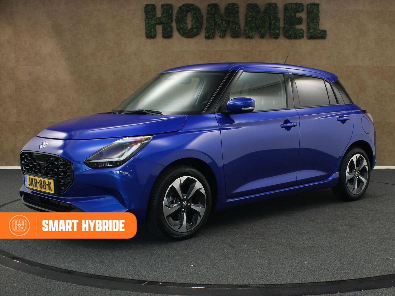 Suzuki SWIFT 1.2 Style Smart Hybrid - CLIMATE CONTROL - NAVIGATIE - PARKEERSENSOREN ACHTER - 16 INCH LICHT METALEN VELGEN - VREDESTEIN 4 SEIZOENENBANDEN - 4 X ELEKTRISCHE RAMEN - KEYLESS ENTRY/ START - CAMERA - VOORSTOELEN VERWARMD - DODEHOEK DETECTIE