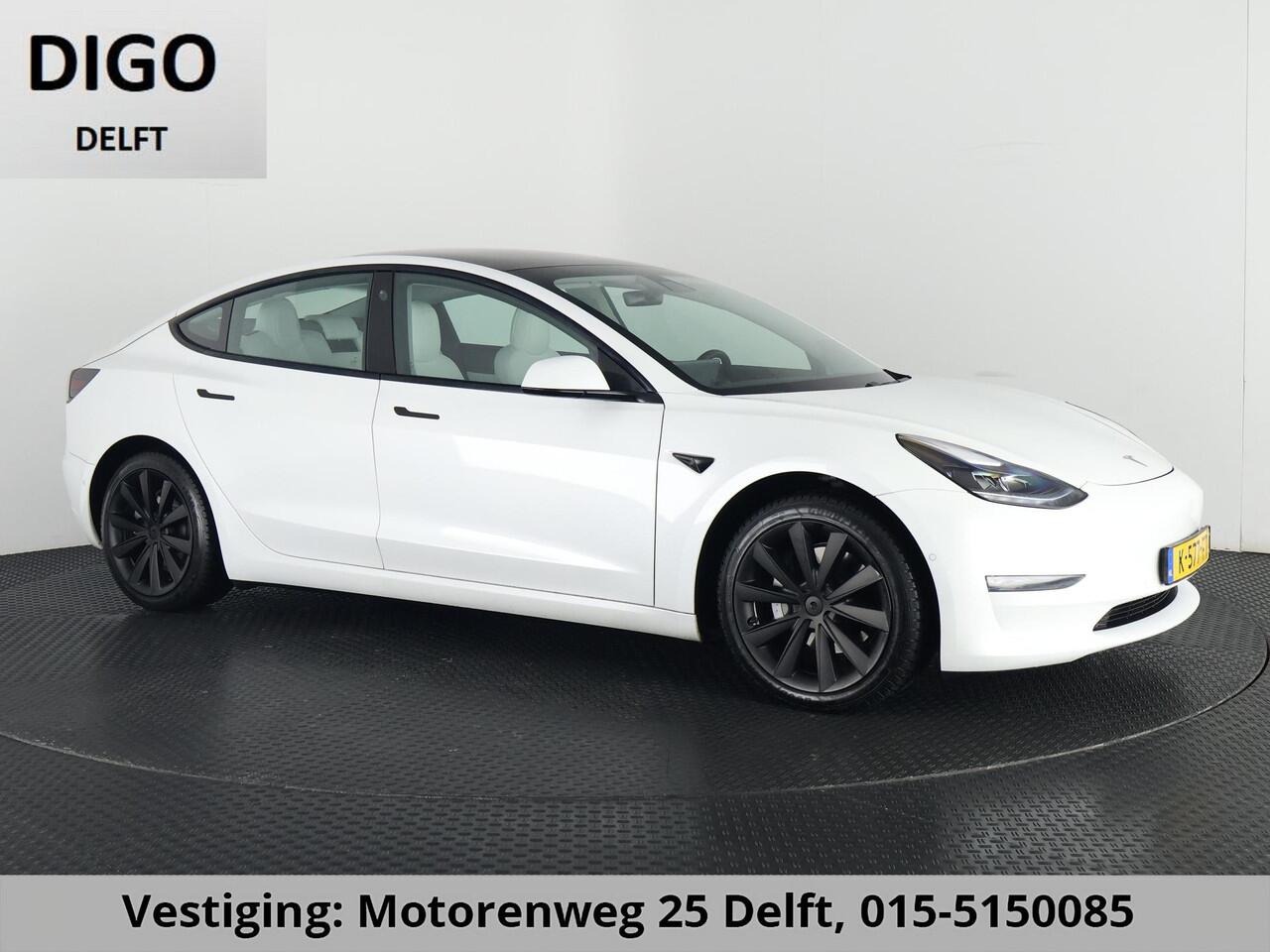 Tesla Model 3 LONGRANGE AWD 1e EIG ACCU SOH 92% ! GARANTIE 2031* RANGE TOT 592 KM WLTP !!! BIJNA 2021 .TREKHAAK . PANORAMA DAK . VOOR & ACHTERSTOELEN VERWARMD . KEYLESS