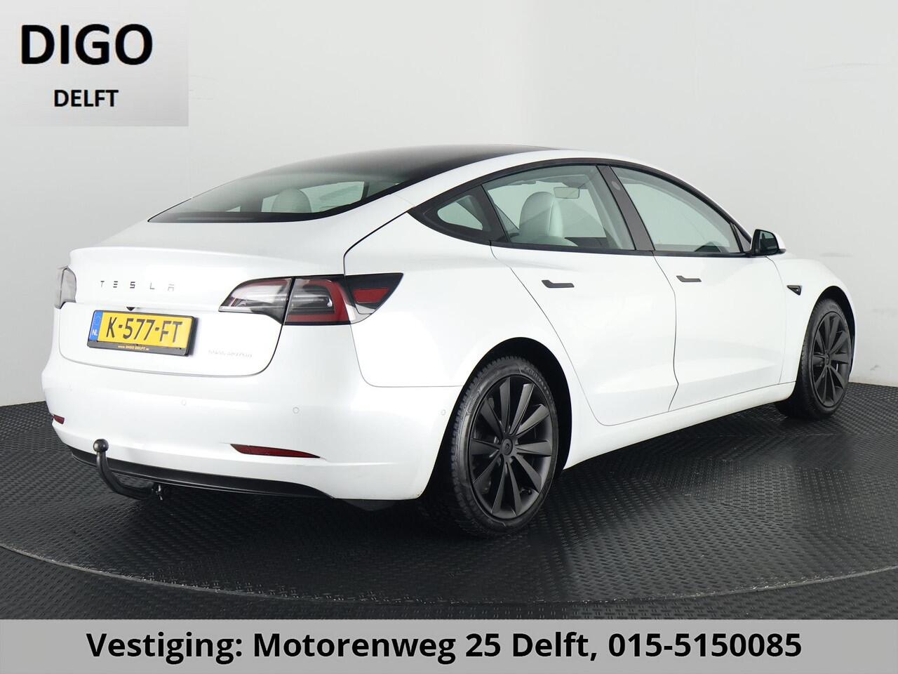 Tesla Model 3 LONGRANGE AWD 1e EIG ACCU SOH 92% ! GARANTIE 2031* RANGE TOT 592 KM WLTP !!! BIJNA 2021 .TREKHAAK . PANORAMA DAK . VOOR & ACHTERSTOELEN VERWARMD . KEYLESS