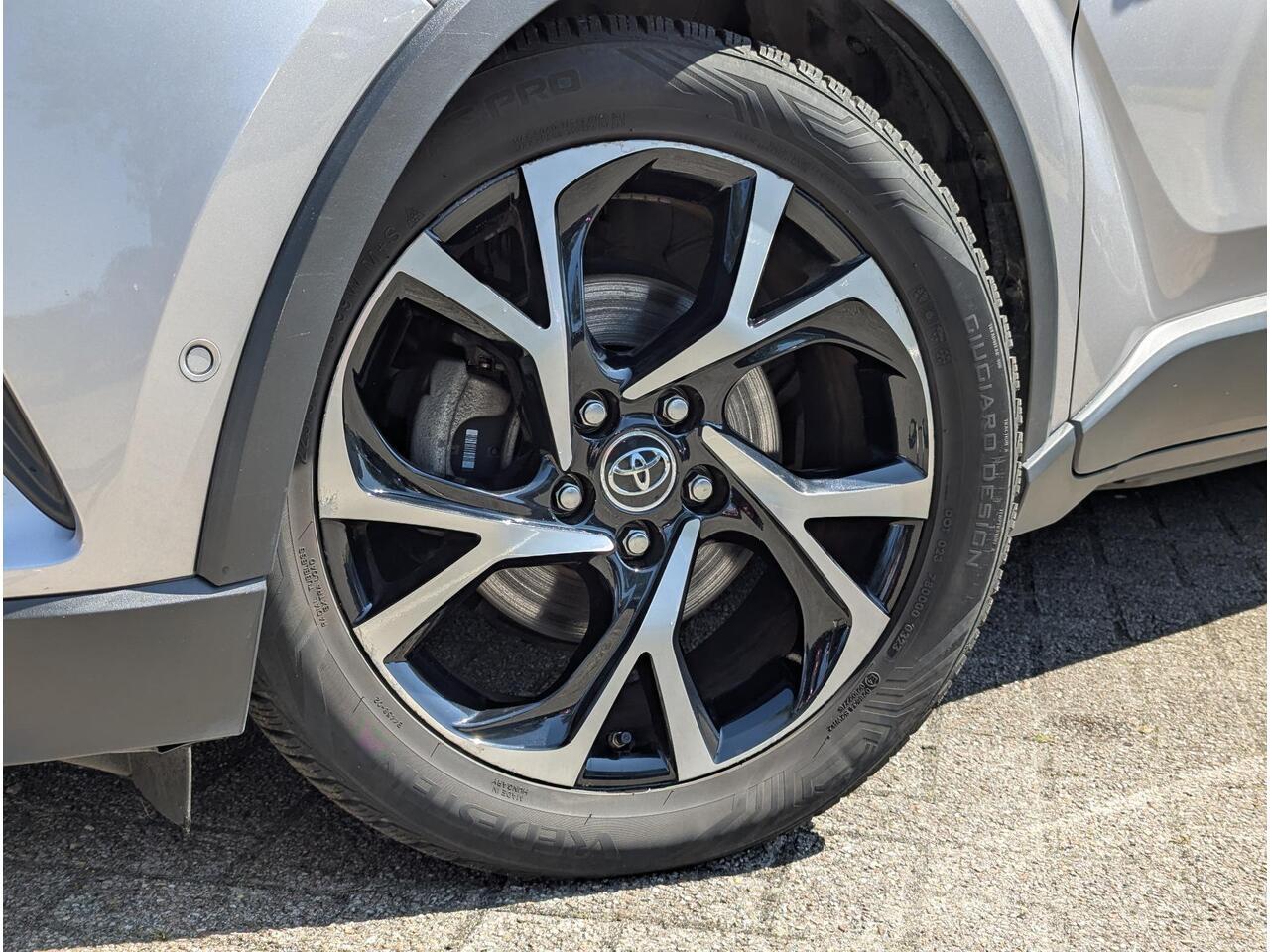 Toyota C-HR 1.8 Hybrid Style | Clima | Cruise | Navi | JBL | Stoelverw. | Trekhaak | BSM