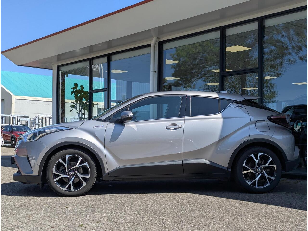 Toyota C-HR 1.8 Hybrid Style | Clima | Cruise | Navi | JBL | Stoelverw. | Trekhaak | BSM