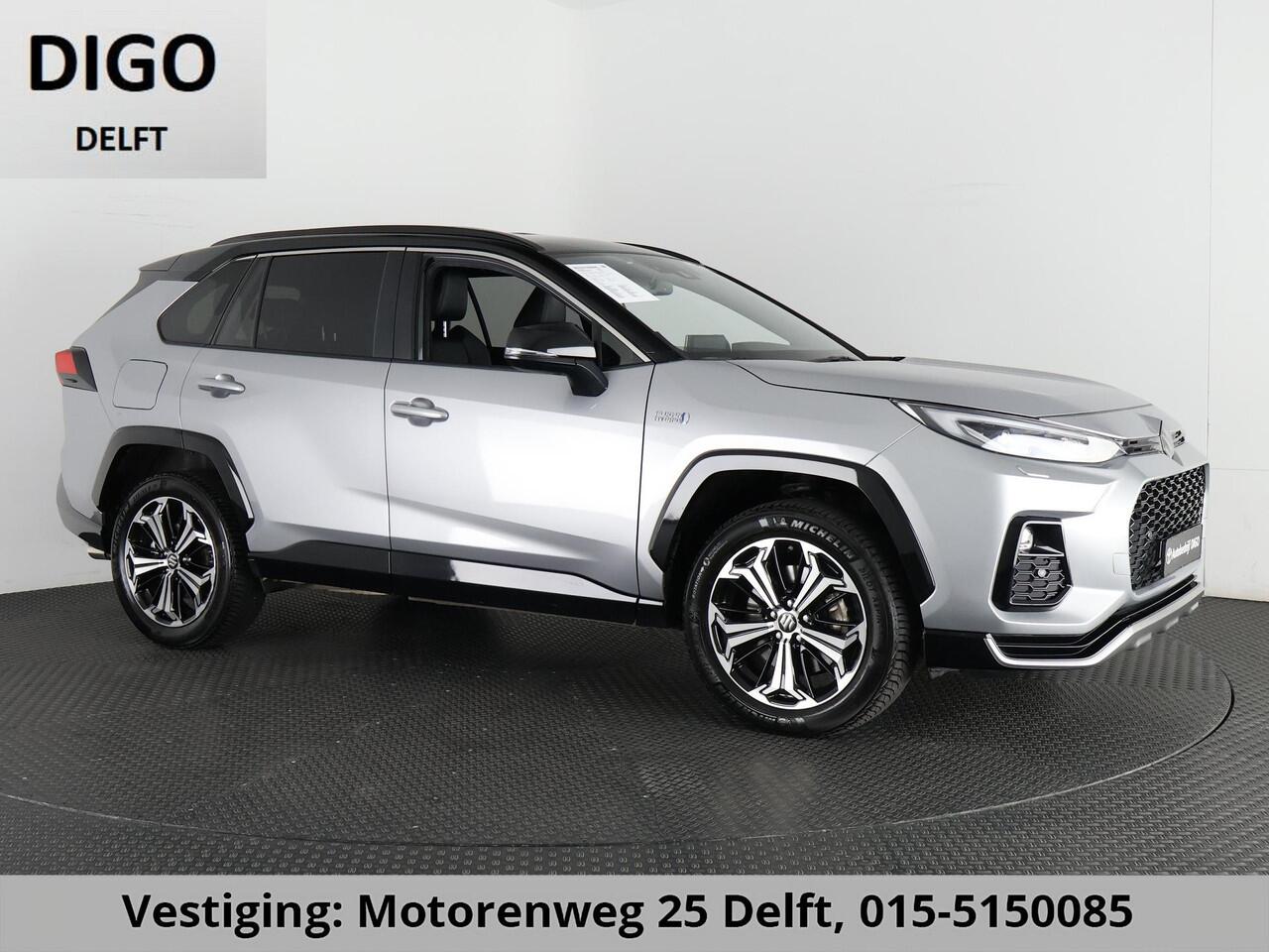 Toyota RAV4 2.5 PLUG-IN AWD STYLE SUZUKI ACROSS 1e EIG. GARANTIE 3-2033.*BI-TONE BODY PACK.HALF LEDER.STOELVERWARMING. CARPLAY. CAMERA.