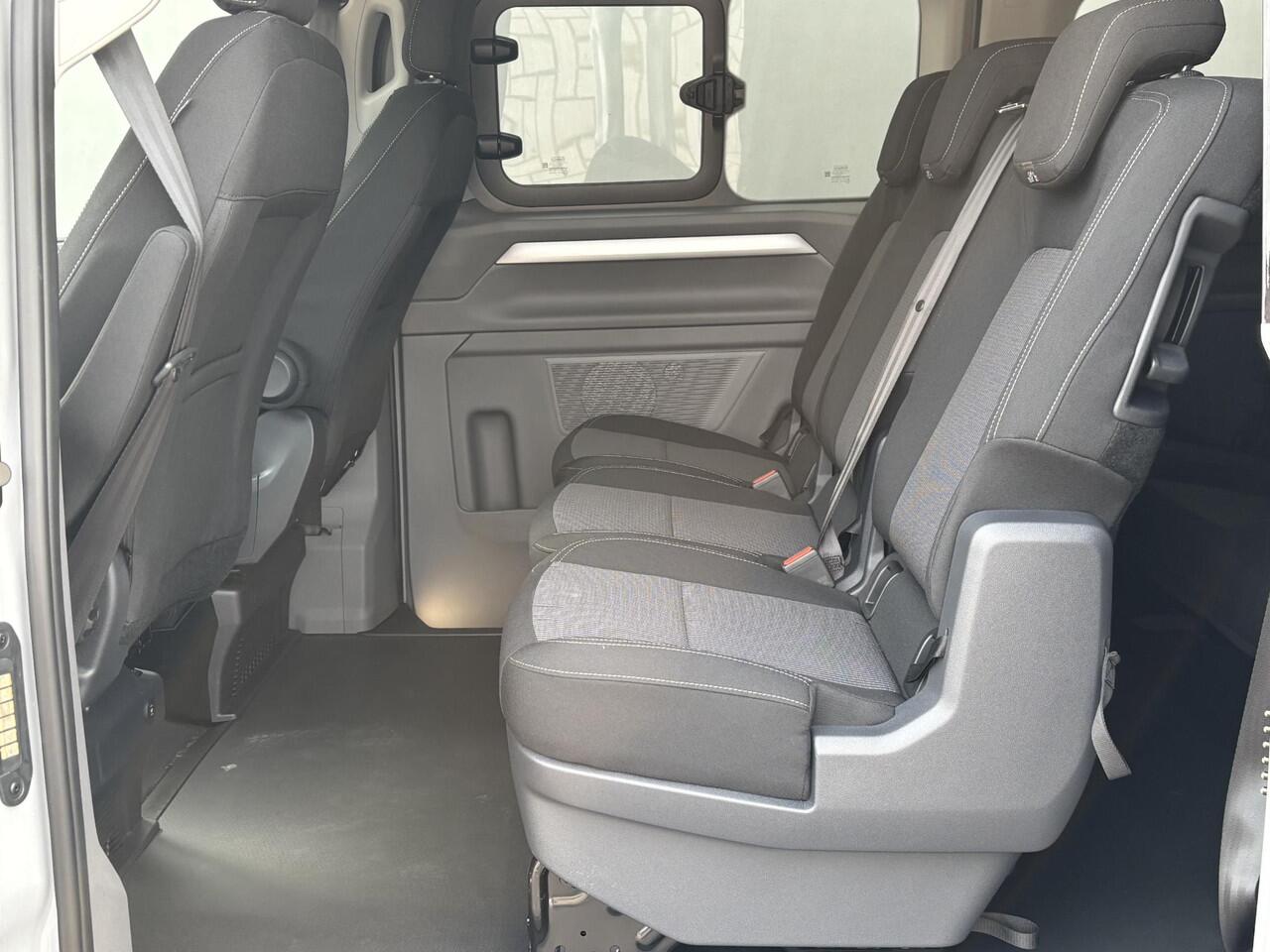 Volkswagen E-Transporter Caravelle 32 L1H1 Life 64 kWh Automaat / NIEUW/ Fabrieksgarantie tot 12-2027 / 8 Persoons / WLTP 305 km / Stone Gray / Warmtepomp / Apple Carplay/Android Auto / Licht en zicht-pakket / Keyless entry / draadloze telefoonlader /