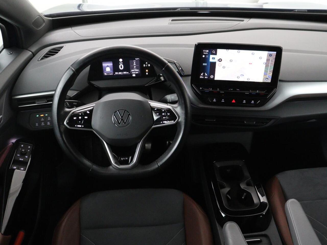 Volkswagen ID.4 First 77 kWh | SOH 90% | Stoel & stuurverwarming | Adaptive cruise | Camera | Carplay | Half leder | Navigatie | 20'' | Full LED | Keyless | Climate control | Sfeerverlichting