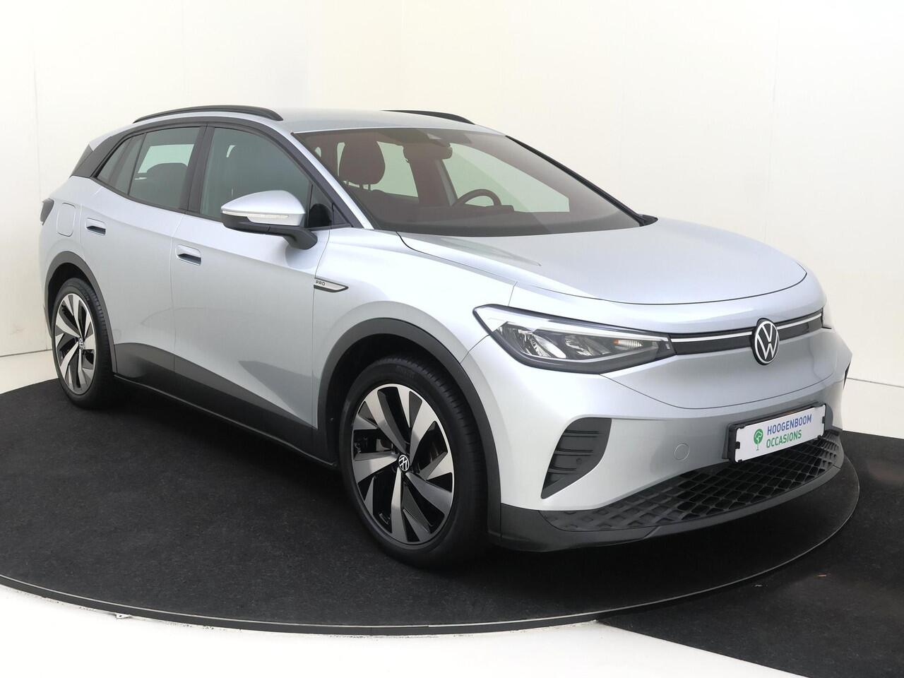 Volkswagen ID.4 Life 77 kWh | SoH 90% | Navigatie | Adaptieve cruise control | Stoelverwarming | Parkeersensoren | CarPlay | Elektrisch inklapbare buitenspiegels | Voorklimatisering |