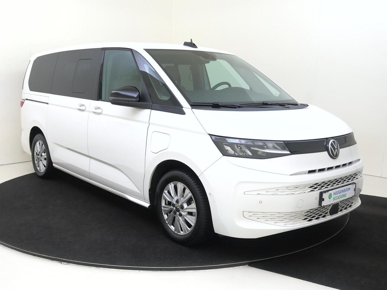 Volkswagen MULTIVAN 1.4 eHybrid L2 Style 6 versnellingen DSG | SoH 94% | 7p | Parkeerassistent | Stoelverwarming | Achteruitrijcamera | Navigatie | 3-zone airco | CarPlay |