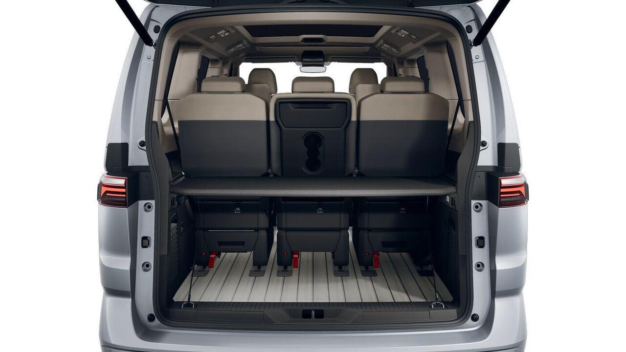 Volkswagen MULTIVAN Bulli L2 1.5 Ehybrid 180kW 245 pk DSG 4 motion | Versterkte kunststof vloerbedekking in houtlook | Multifunctionele verschuifbare tafel in passagiersruimte | Navigatiesysteem '' Discover Pro'' | Privacy Plus glas (90%) vanaf B-stijl |
