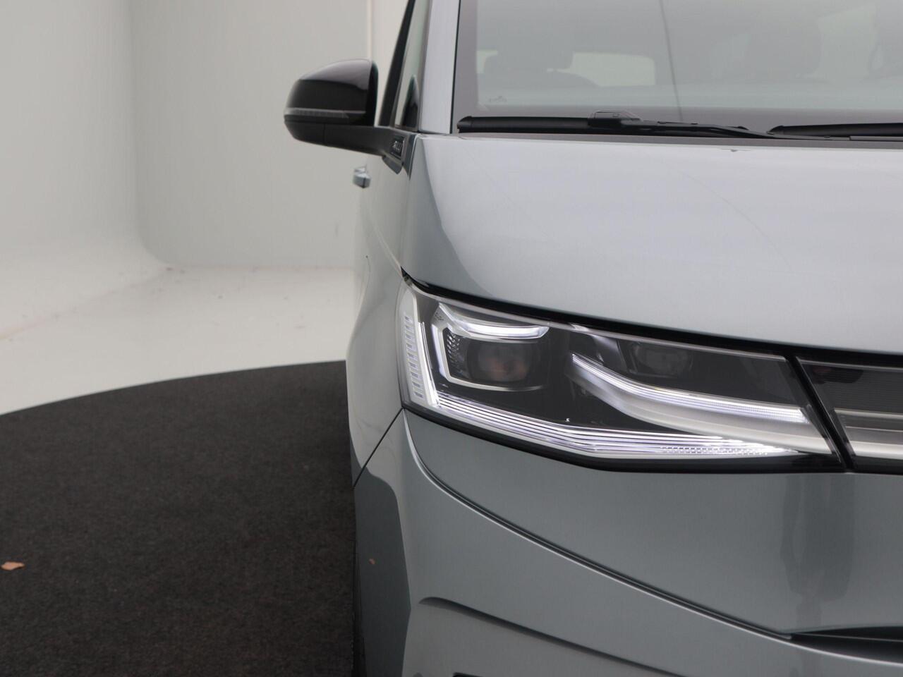 Volkswagen MULTIVAN Bedrijfswagens Bulli L2 1.5 eHybrid EU6 180 kW/245pk DSG 4Motion | Incl BTW/BPM | 7 zitplaatsen vis-a-vis | Trekhaak | Stoelverwarming | Verlaagd onderstel dynamisch | 19" Halmstad lichtmetaal |