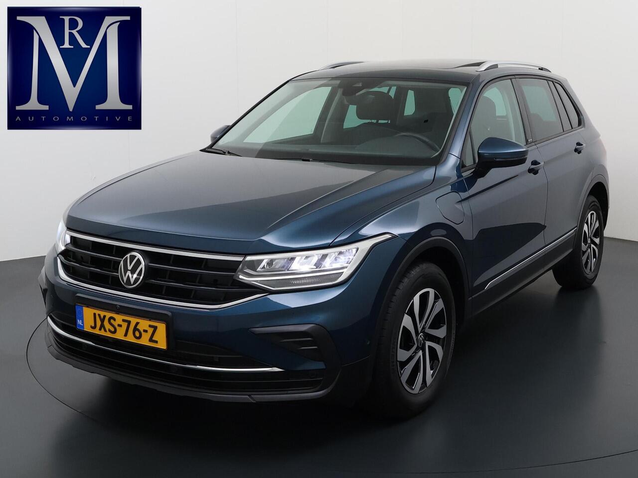Volkswagen TIGUAN 1.4 TSI eHybrid PHEV VAN ¤32.900,- NU VOOR SLECHTS ¤29.877,- Uw LENTEVOORDEEL ¤3.023,- |ADAPTIVE CRUISE CONTROL| PANO| STOEL + STUURVERWARMING| 360 CAMERA| PARKEER ASSISTENT| RIJKLAARPRIJS INCL. 12 MND BOVAG GARANTIE